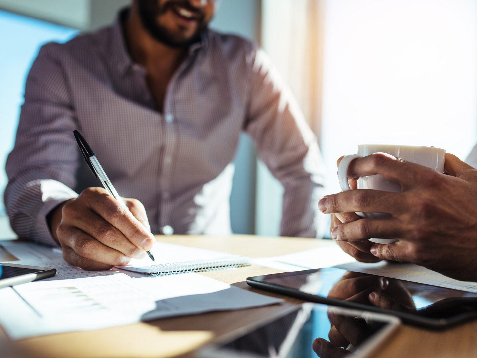 Business people sitting at table planning