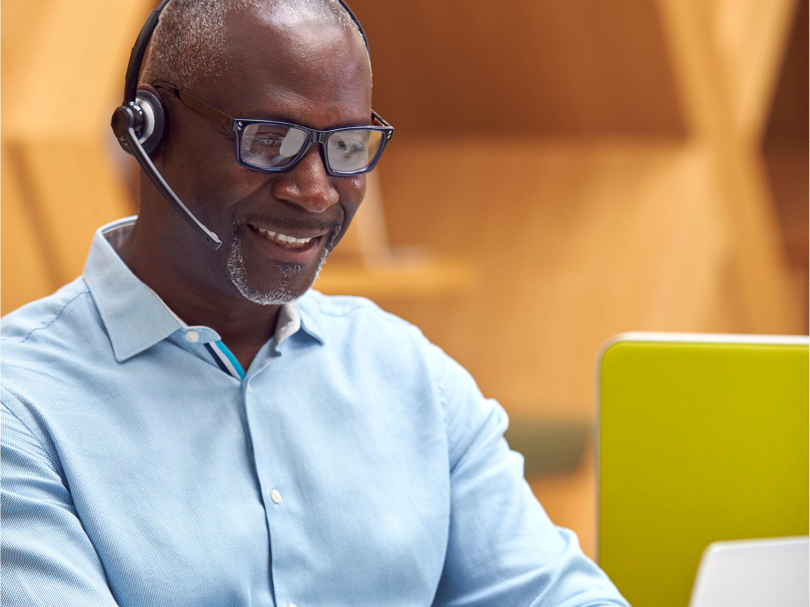 A person wearing a headset and negotiating a contract