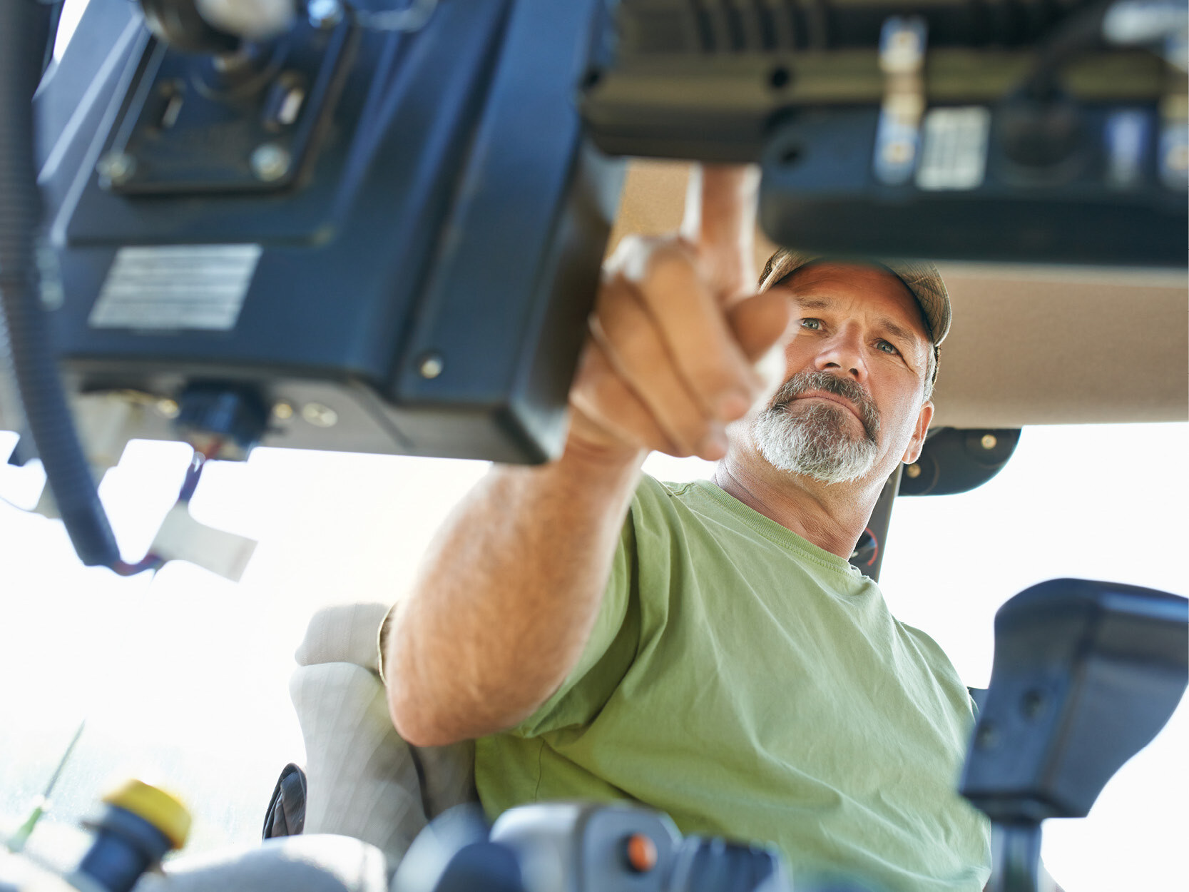 A machine operator in the field