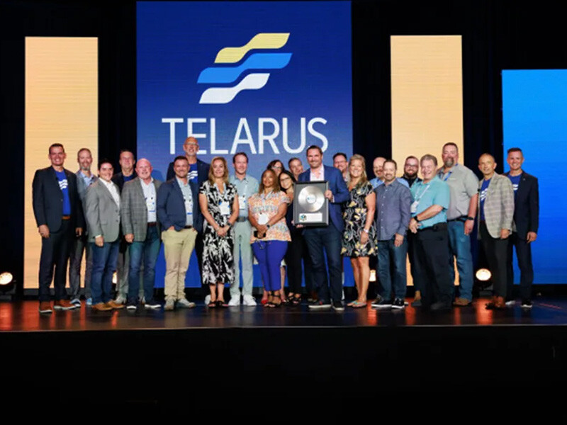 vCom team onstage at the Telarus awards event